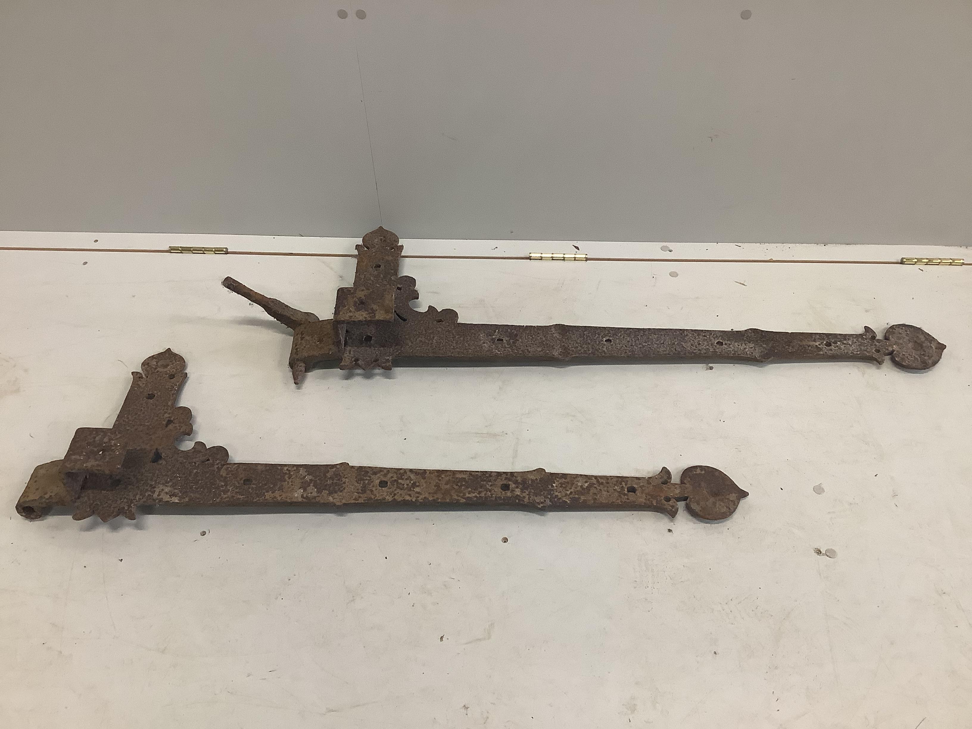 A set of eight large cast iron door hinges, length 110cm